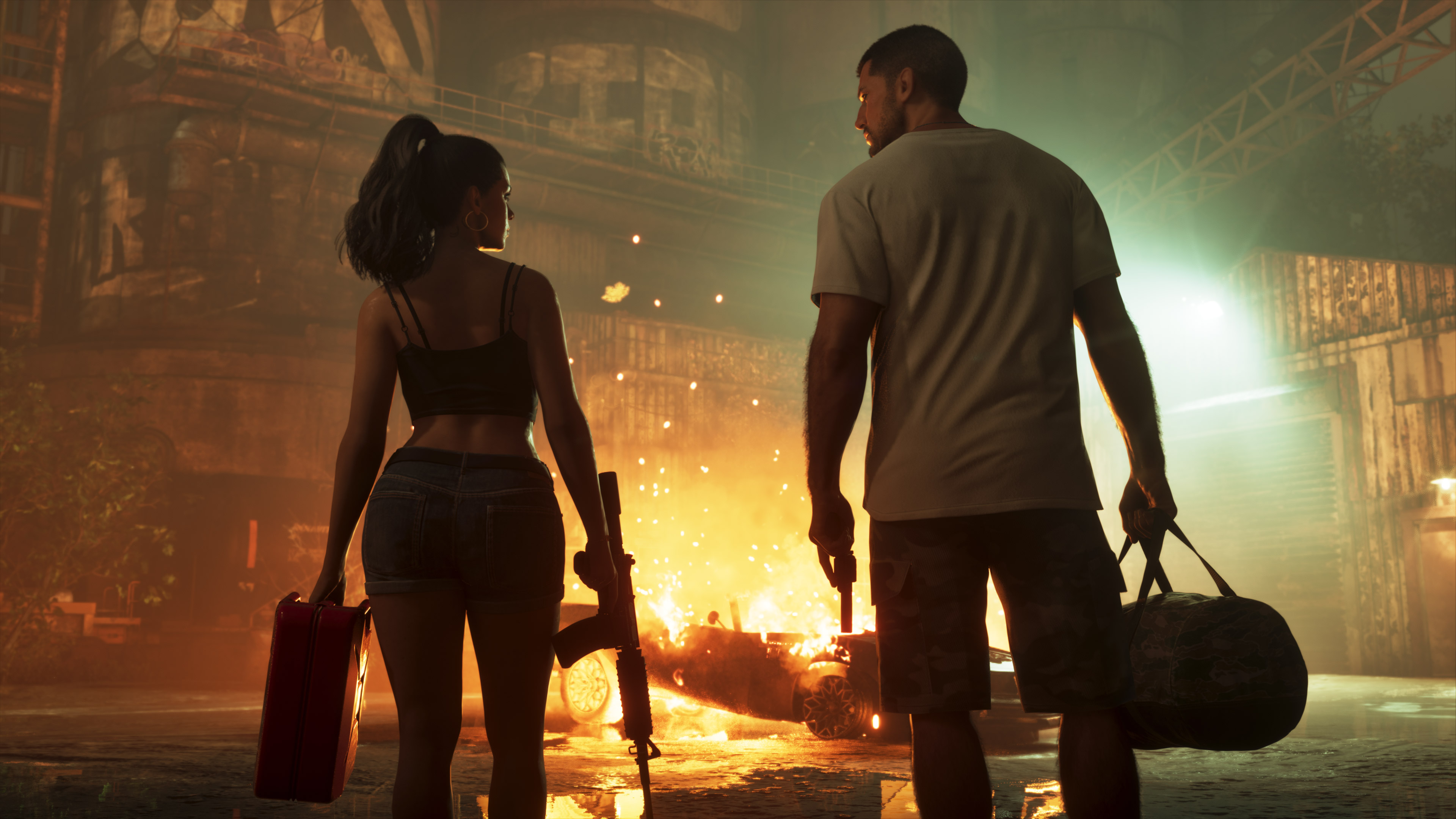 Jason and Lucia walking away from a burning vehicle with a suitcase and duffel